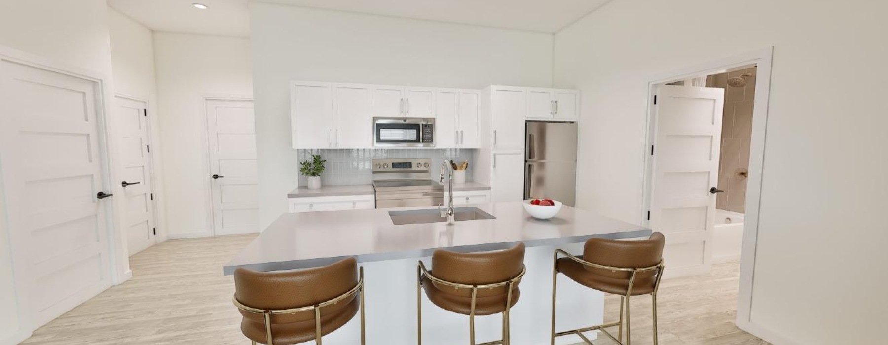 Light, bright, kitchen with an island and barstools
