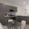 a kitchen with a table and chairs