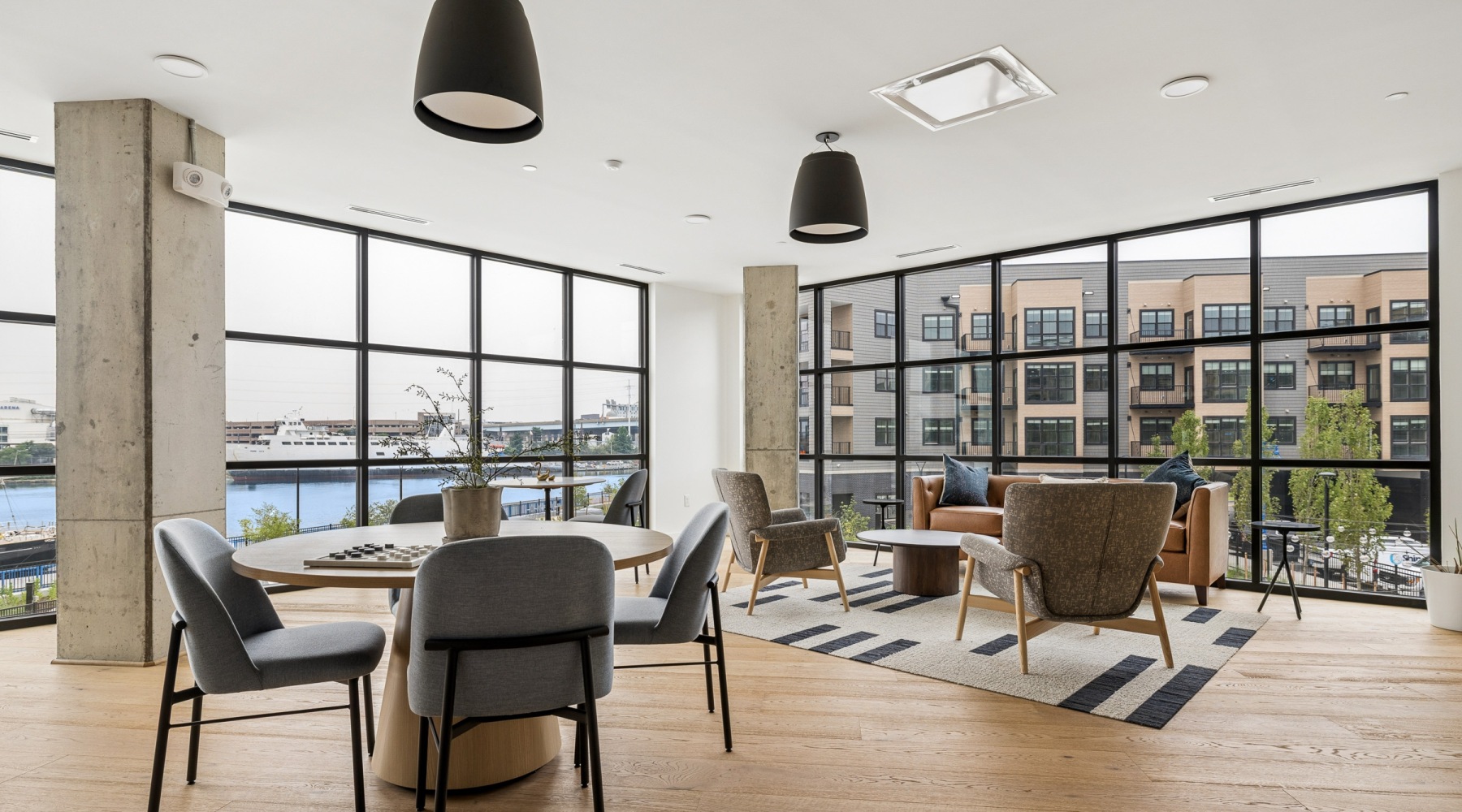 Interior space with floor the ceiling windows and waterfront views