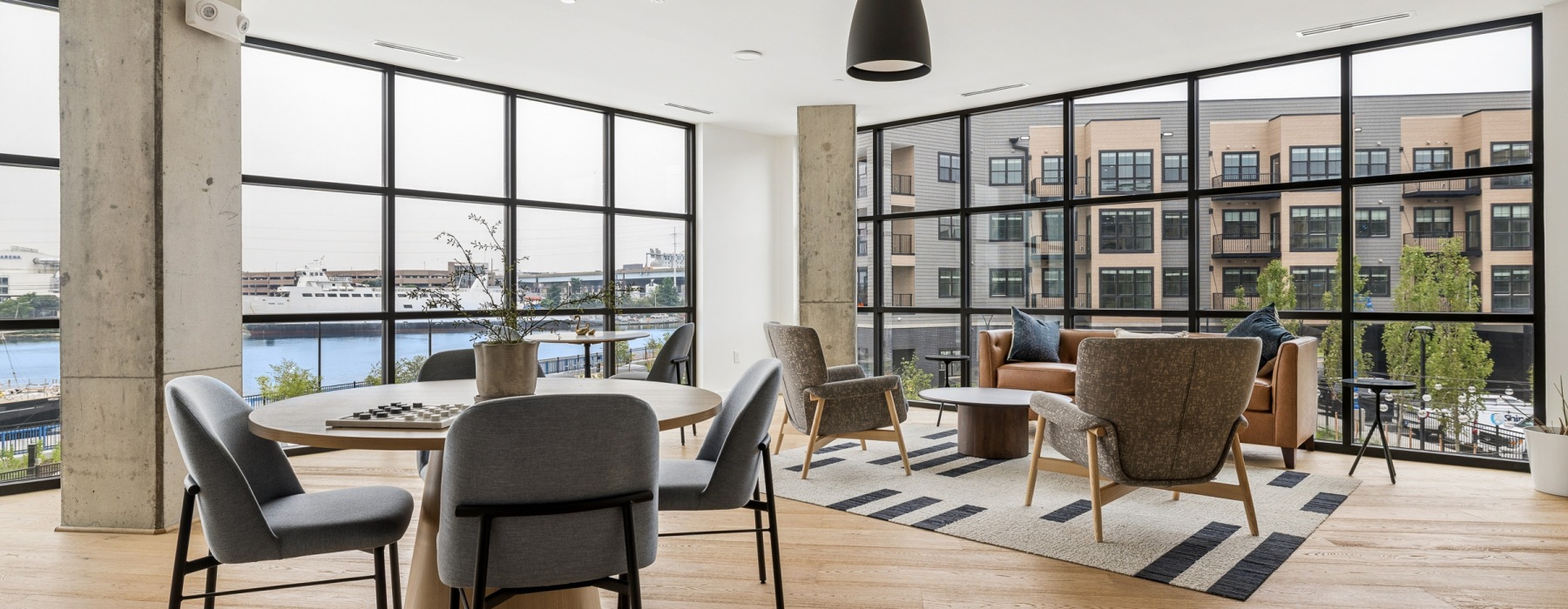 Interior space with floor the ceiling windows and waterfront views